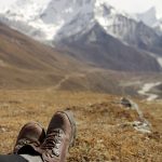 sitting in the field looking at mountains